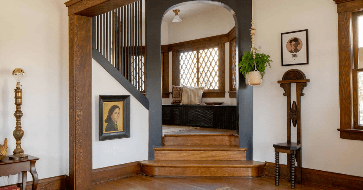 Interior of a Craftsman house, showcasing wooden accents and staircase.