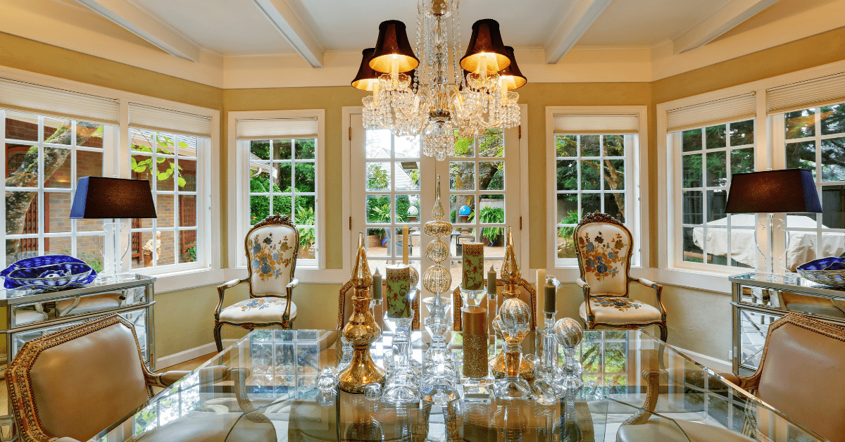 Victorian style dining room with glass table and victorian styled furniture.